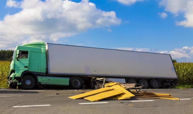 semi-truck-crashed-on-side-of-road