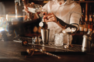 Bartender violating Texas dram shop law by overserving patron.