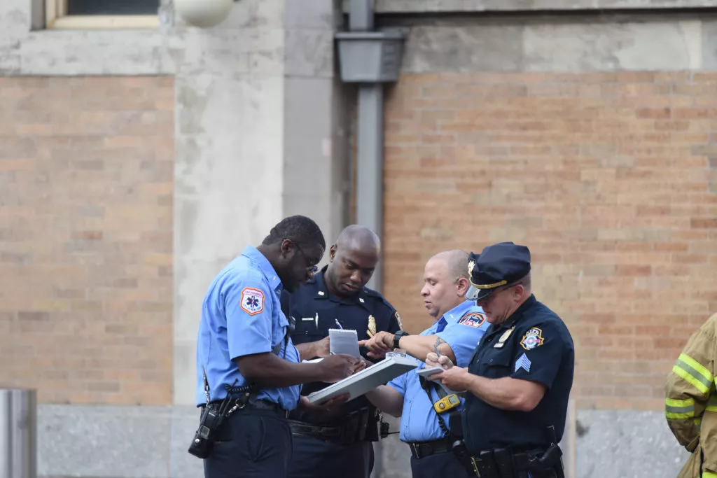 Texas police officers determining who was responsible for a three-way car accident.